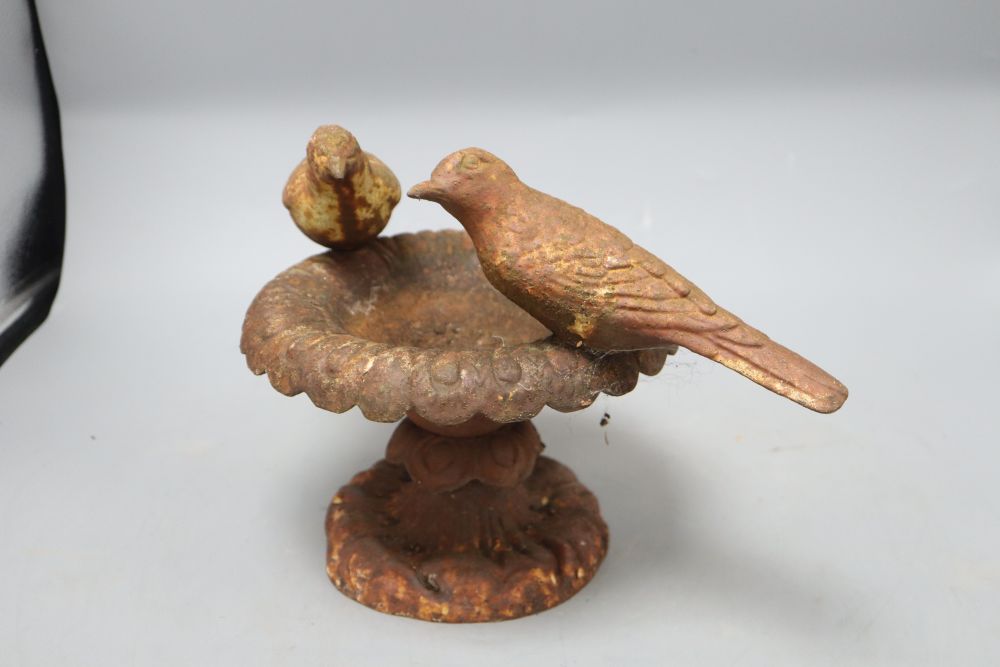 A cast iron bird bath, Doves of Pliny, height 21cm